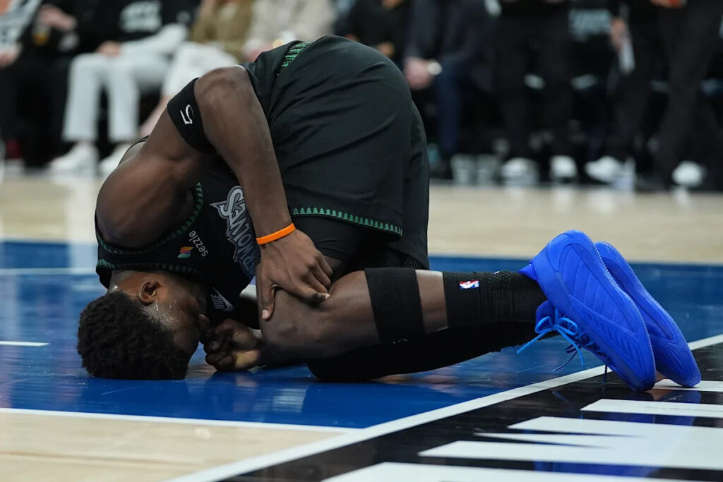 Wolves’ Anthony Edwards has bone bruise in left knee, AP source says. He’s likely to miss weeks