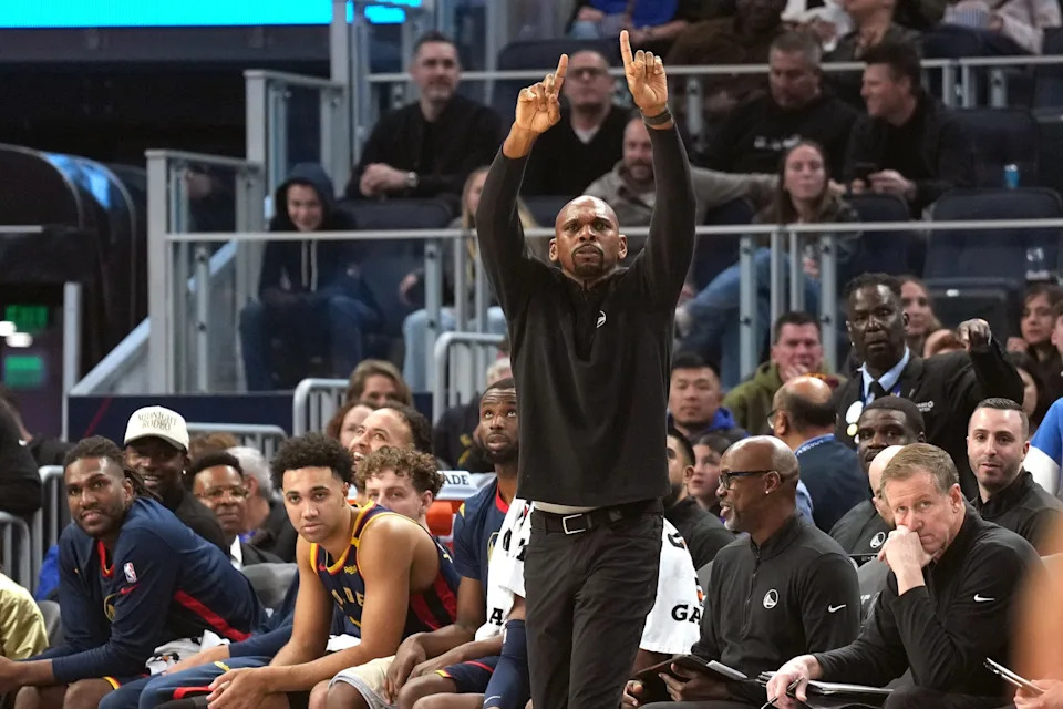 Golden State Warriors assistant coach Jerry Stackhouse (center) gestures during the second quarter against the Los Angeles Lakers at Chase Center.