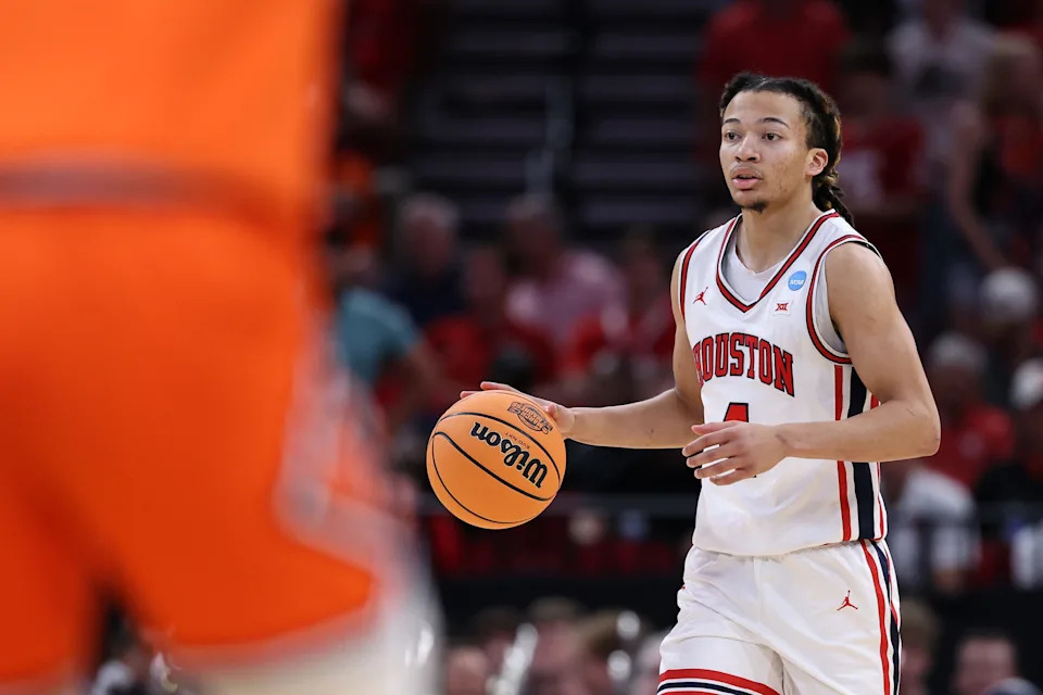 Houston Cougars guard Kingston Flemings (4) dribbles the ball against the Illinois Fighting Illini in the first half during a Sweet Sixteen game of the South Regional of the men's 2026 NCAA Tournament at Toyota Center.