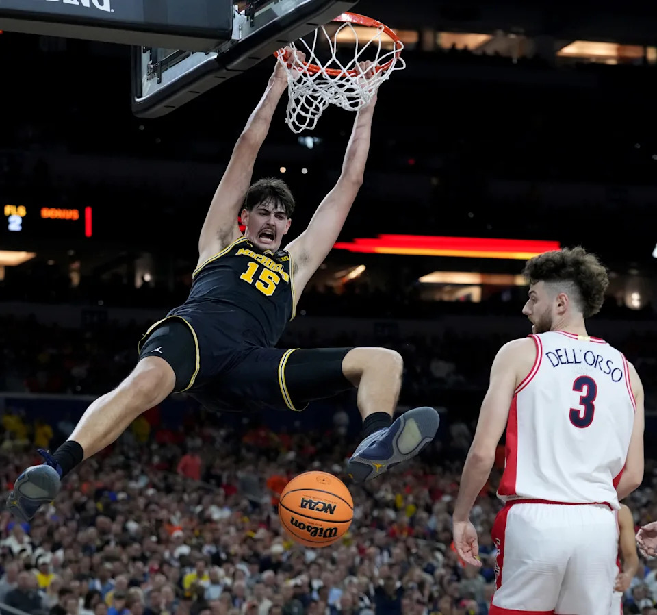 Michigan Wolverines center Aday Mara (15) dunks Saturday, April 4, 2026, during a Final Four game against the Arizona Wildcats at Lucas Oil Stadium in Indianapolis.