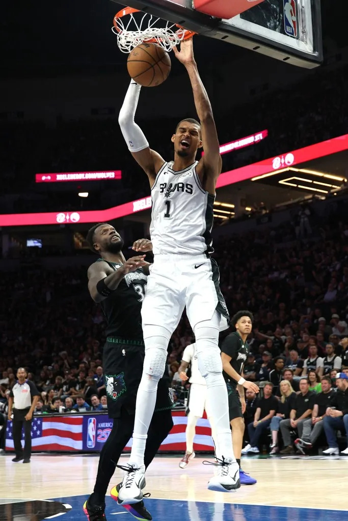 Victor Wembanyam, who scored 19 points, slams home a dunk over <br><a class="link " href="https://sports.yahoo.com/nba/players/5318/" data-i13n="sec:content-canvas;subsec:anchor_text;elm:context_link" data-ylk="slk:Julius Randle;sec:content-canvas;subsec:anchor_text;elm:context_link;itc:0" data-yga="{"yLinkElement":"context_link","yModuleName":"content-canvas","yLinkText":"Julius Randle","ySubModuleName":"anchor_text","yHasCommerce":false}">Julius Randle</a> during the Spurs’ Game 6 series-clinching win over <br>the Timberwolves. Getty Images