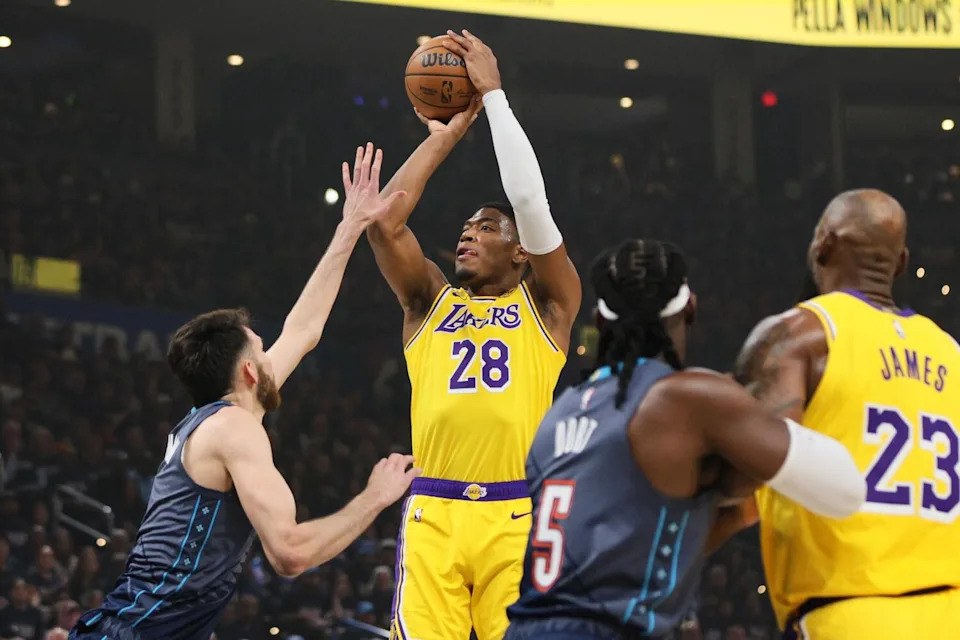 Lakers forward Rui Hachimura, center, pulls up for a host over Thunder center Chet Holmgren, left, during Game 2.