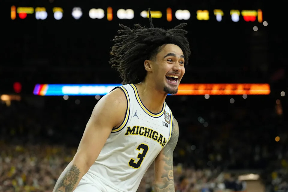 Michigan Wolverines guard Elliot Cadeau (3) celebrates after their win against the UConn Huskies in the national championship of the Final Four of the men's 2026 NCAA Tournament between the and the Michigan Wolverines at Lucas Oil Stadium.