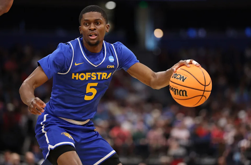 Hofstra Pride guard Cruz Davis (5) dribbles in the second half against the Alabama Crimson Tide during a first round game of the men's 2026 NCAA Tournament at Benchmark International Arena.