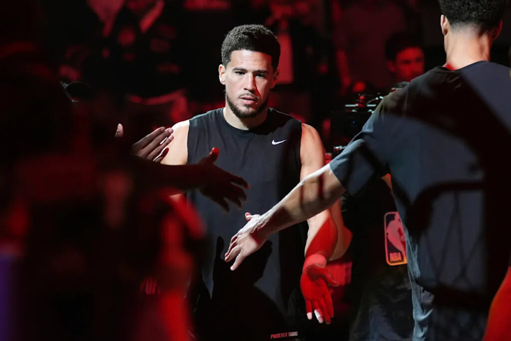 Suns’ All-Star guard Devin Booker changes jersey number to No. 15 in honor of his dad Melvin