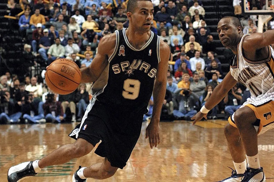<a class="link " href="https://sports.yahoo.com/nba/teams/san-antonio/" data-i13n="sec:content-canvas;subsec:anchor_text;elm:context_link" data-ylk="slk:San Antonio Spurs;sec:content-canvas;subsec:anchor_text;elm:context_link;itc:0" data-yga="{"yLinkElement":"context_link","yModuleName":"content-canvas","yLinkText":"San Antonio Spurs","ySubModuleName":"anchor_text","yHasCommerce":false}">San Antonio Spurs</a> guard Tony Parker (L) works his way around <a class="link " href="https://sports.yahoo.com/nba/teams/indiana/" data-i13n="sec:content-canvas;subsec:anchor_text;elm:context_link" data-ylk="slk:Indiana Pacers;sec:content-canvas;subsec:anchor_text;elm:context_link;itc:0" data-yga="{"yLinkElement":"context_link","yModuleName":"content-canvas","yLinkText":"Indiana Pacers","ySubModuleName":"anchor_text","yHasCommerce":false}">Indiana Pacers</a> guard Jamall Tinsley (R) in the first quarter 23 November 2001 at the Conseco Fieldhouse in Indianapolis, IN. Parker, who is from France, is playing his first year in the NBA. AFP PHOTO by John RUTHROFF (Photo by JOHN RUTHROFF / AFP via Getty Images) | AFP via Getty Images
