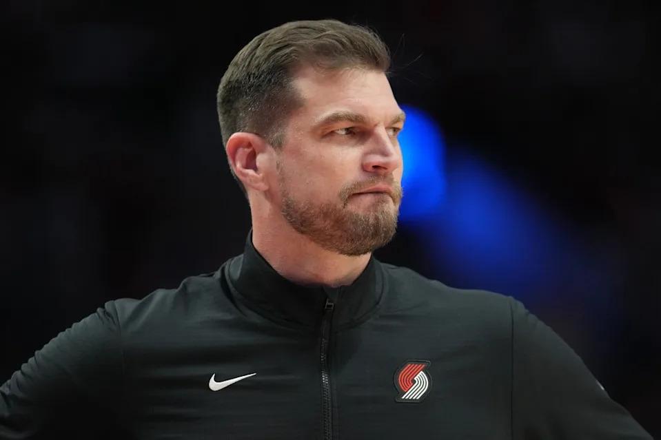 Acting head coach Tiago Splitter of the <a class="link " href="https://sports.yahoo.com/nba/teams/portland/" data-i13n="sec:content-canvas;subsec:anchor_text;elm:context_link" data-ylk="slk:Portland Trail Blazers;sec:content-canvas;subsec:anchor_text;elm:context_link;itc:0" data-yga="{"yLinkElement":"context_link","yModuleName":"content-canvas","yLinkText":"Portland Trail Blazers","ySubModuleName":"anchor_text","yHasCommerce":false}">Portland Trail Blazers</a> watches from the sideline during the first half against the <a class="link " href="https://sports.yahoo.com/nba/teams/la-clippers/" data-i13n="sec:content-canvas;subsec:anchor_text;elm:context_link" data-ylk="slk:Los Angeles Clippers;sec:content-canvas;subsec:anchor_text;elm:context_link;itc:0" data-yga="{"yLinkElement":"context_link","yModuleName":"content-canvas","yLinkText":"Los Angeles Clippers","ySubModuleName":"anchor_text","yHasCommerce":false}">Los Angeles Clippers</a> at Moda Center on April 10, 2026 in Portland, Oregon. Getty Images
