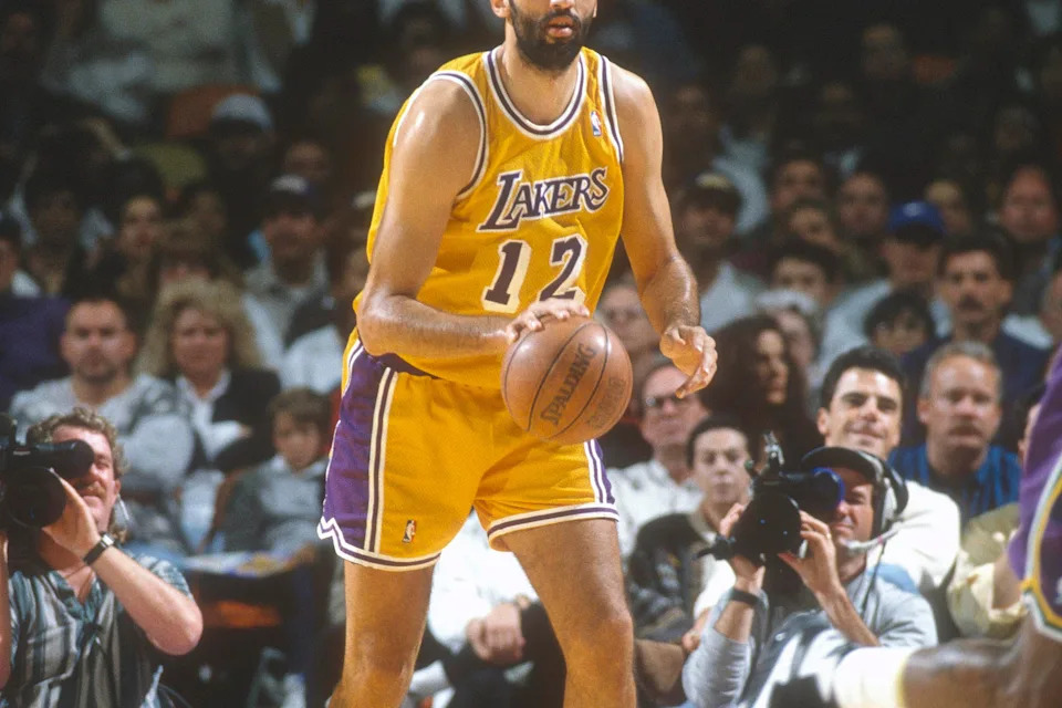 INGLEWOOD, CA – CIRCA 1995: Vlade Divac #12 of the <a class="link " href="https://sports.yahoo.com/nba/teams/la-lakers/" data-i13n="sec:content-canvas;subsec:anchor_text;elm:context_link" data-ylk="slk:Los Angeles Lakers;sec:content-canvas;subsec:anchor_text;elm:context_link;itc:0" data-yga="{"yLinkElement":"context_link","yModuleName":"content-canvas","yLinkText":"Los Angeles Lakers","ySubModuleName":"anchor_text","yHasCommerce":false}">Los Angeles Lakers</a> dribbles the ball against the <a class="link " href="https://sports.yahoo.com/nba/teams/utah/" data-i13n="sec:content-canvas;subsec:anchor_text;elm:context_link" data-ylk="slk:Utah Jazz;sec:content-canvas;subsec:anchor_text;elm:context_link;itc:0" data-yga="{"yLinkElement":"context_link","yModuleName":"content-canvas","yLinkText":"Utah Jazz","ySubModuleName":"anchor_text","yHasCommerce":false}">Utah Jazz</a> during an NBA basketball game circa 1995 at The Forum in Inglewood, California. Divac played for the Lakers from 1989-96. (Photo by Focus on Sport/Getty Images) | Getty Images