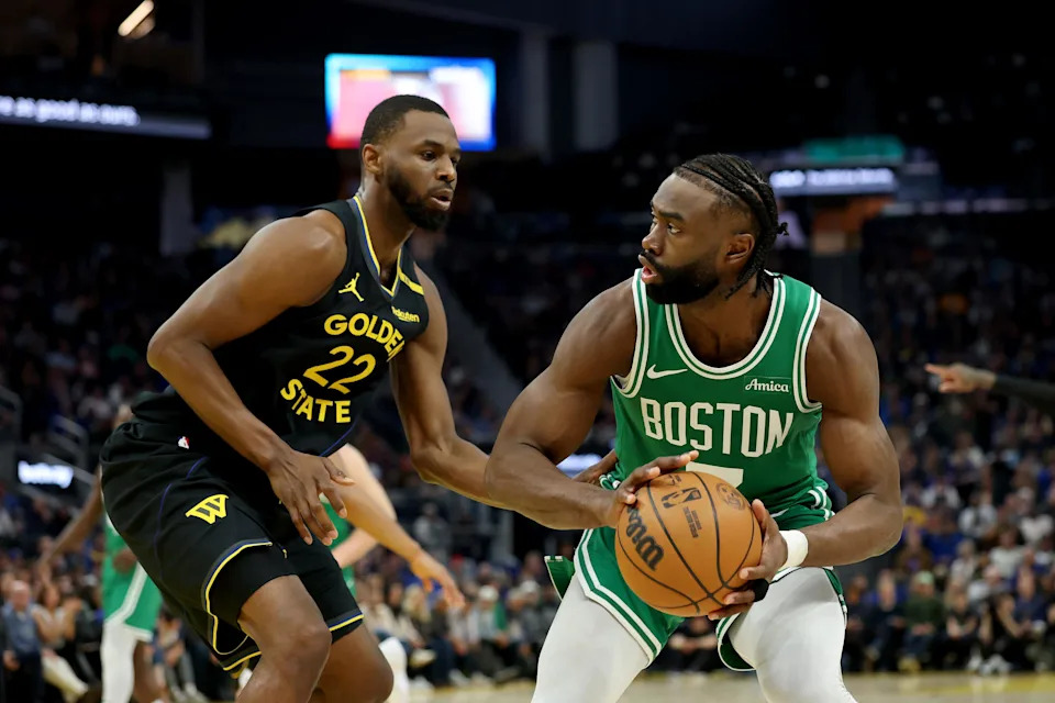SAN FRANCISCO, CALIFORNIA – JANUARY 20: <a class="link " href="https://sports.yahoo.com/nba/players/5602/" data-i13n="sec:content-canvas;subsec:anchor_text;elm:context_link" data-ylk="slk:Jaylen Brown;sec:content-canvas;subsec:anchor_text;elm:context_link;itc:0" data-yga="{"yLinkElement":"context_link","yModuleName":"content-canvas","yLinkText":"Jaylen Brown","ySubModuleName":"anchor_text","yHasCommerce":false}">Jaylen Brown</a> #7 of the Boston Celtics is guarded by <a class="link " href="https://sports.yahoo.com/nba/players/5292/" data-i13n="sec:content-canvas;subsec:anchor_text;elm:context_link" data-ylk="slk:Andrew Wiggins;sec:content-canvas;subsec:anchor_text;elm:context_link;itc:0" data-yga="{"yLinkElement":"context_link","yModuleName":"content-canvas","yLinkText":"Andrew Wiggins","ySubModuleName":"anchor_text","yHasCommerce":false}">Andrew Wiggins</a> #22 of the <a class="link " href="https://sports.yahoo.com/nba/teams/golden-state/" data-i13n="sec:content-canvas;subsec:anchor_text;elm:context_link" data-ylk="slk:Golden State Warriors;sec:content-canvas;subsec:anchor_text;elm:context_link;itc:0" data-yga="{"yLinkElement":"context_link","yModuleName":"content-canvas","yLinkText":"Golden State Warriors","ySubModuleName":"anchor_text","yHasCommerce":false}">Golden State Warriors</a> during the first half at Chase Center on January 20, 2025 in San Francisco, California. NOTE TO USER: User expressly acknowledges and agrees that, by downloading and/or using this photograph, user is consenting to the terms and conditions of the Getty Images License Agreement. (Photo by Ezra Shaw/Getty Images) | Getty Images
