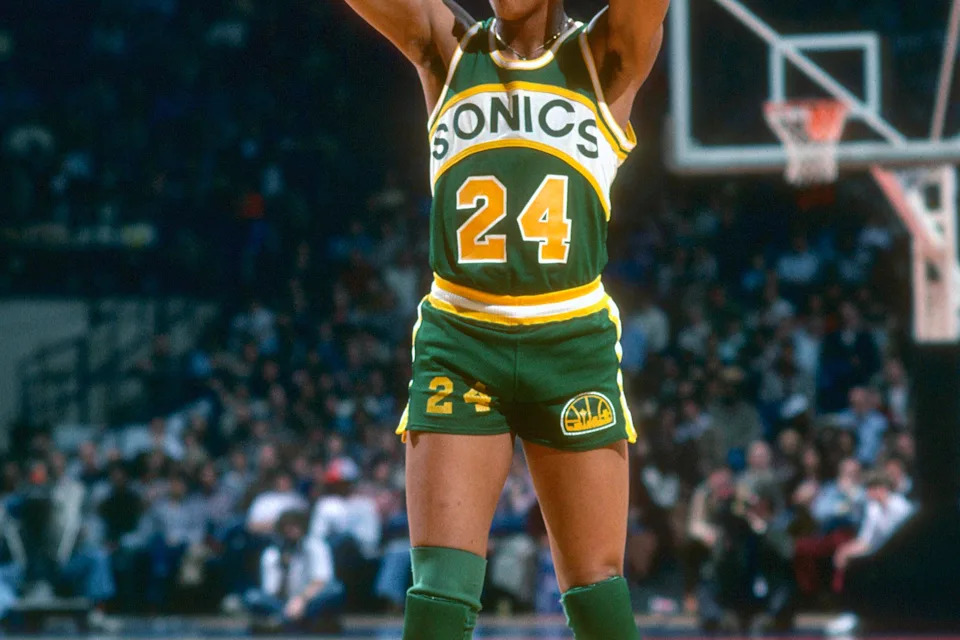 LANDOVER, MD – CIRCA 1978: Dennis Johnson #24 of the Seattle Supersonics looks to pass the ball against the <a class="link " href="https://sports.yahoo.com/nba/teams/washington/" data-i13n="sec:content-canvas;subsec:anchor_text;elm:context_link" data-ylk="slk:Washington Bullets;sec:content-canvas;subsec:anchor_text;elm:context_link;itc:0" data-yga="{"yLinkElement":"context_link","yModuleName":"content-canvas","yLinkText":"Washington Bullets","ySubModuleName":"anchor_text","yHasCommerce":false}">Washington Bullets</a> during an NBA basketball game circa 1978 at the Capital Centre in Landover, Maryland. Johnson played for the Supersonics from 1976-80. (Photo by Focus on Sport/Getty Images) | Getty Images