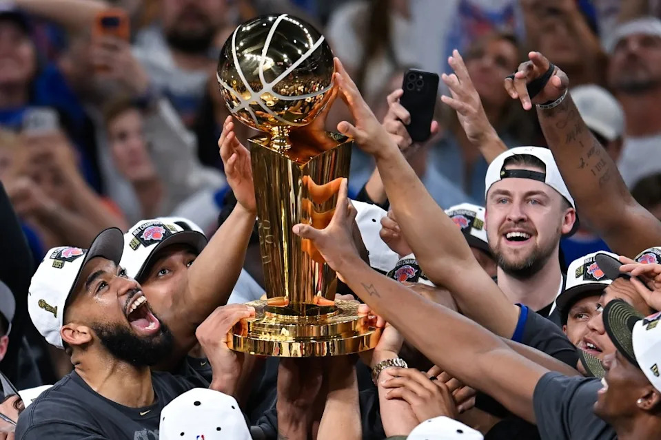 The New York Knicks celebrate with the Larry O’Brien Championship Trophy after defeating the <a class="link " href="https://sports.yahoo.com/nba/teams/san-antonio/" data-i13n="sec:content-canvas;subsec:anchor_text;elm:context_link" data-ylk="slk:San Antonio Spurs;sec:content-canvas;subsec:anchor_text;elm:context_link;itc:0" data-yga="{"yLinkElement":"context_link","yModuleName":"content-canvas","yLinkText":"San Antonio Spurs","ySubModuleName":"anchor_text","yHasCommerce":false}">San Antonio Spurs</a>. AP Photo/Darren Abate