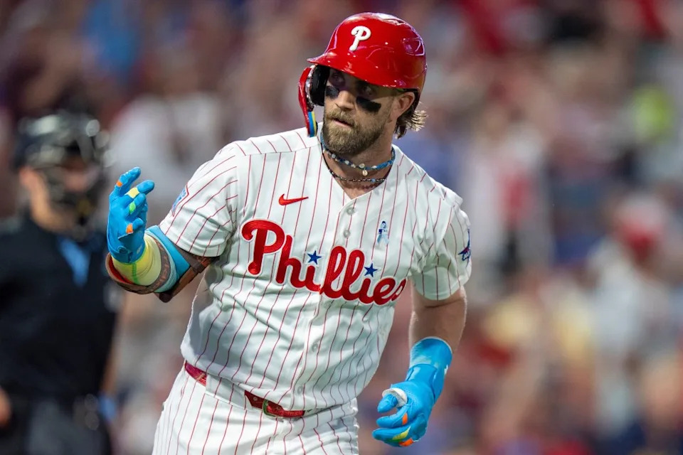 Phillies’ Bryce Harper reacts to his solo home run during the fifth inning of a baseball game against the New York Mets, Sunday, June 21, 2026, in Philadelphia. AP Photo/Chris Szagola
