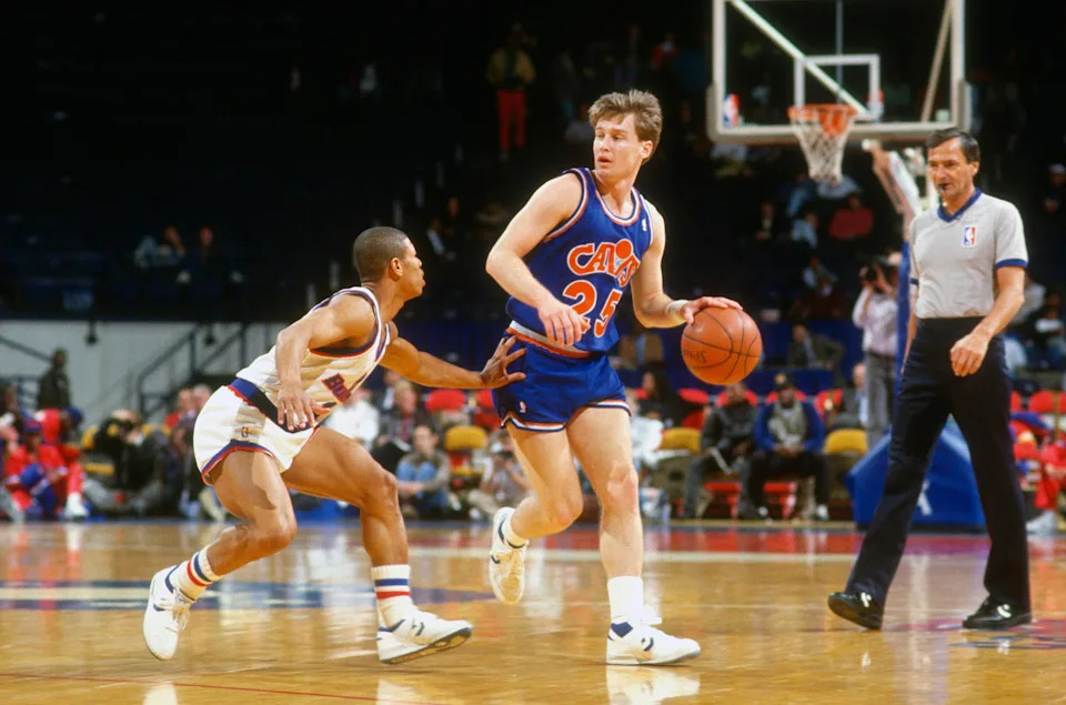 LANDOVER, MD – CIRCA 1987: Mark Price #25 of the Cleveland Cavaliers dribbles the ball while defended by Muggsy Bogues #1 of the Washington Bullets during an NBA basketball game circa 1987 at the Capital Centre in Landover, Maryland. Price played for the Cavaliers from 1986-95. (Photo by Focus on Sport/Getty Images) | Getty Images