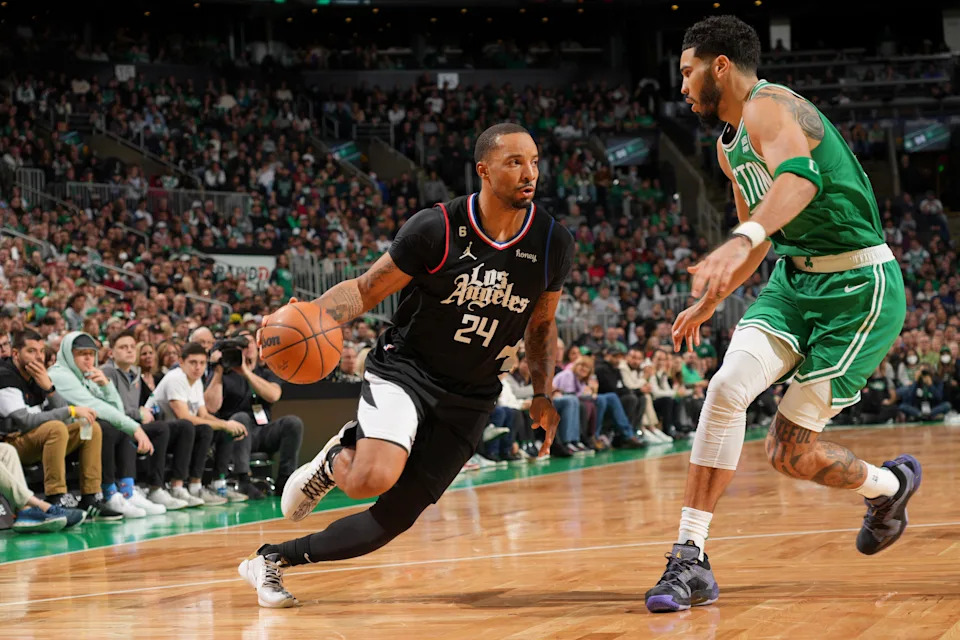 BOSTON, MA – DECEMBER 29: <a class="link " href="https://sports.yahoo.com/nba/players/5506/" data-i13n="sec:content-canvas;subsec:anchor_text;elm:context_link" data-ylk="slk:Norman Powell;sec:content-canvas;subsec:anchor_text;elm:context_link;itc:0" data-yga="{"yLinkElement":"context_link","yModuleName":"content-canvas","yLinkText":"Norman Powell","ySubModuleName":"anchor_text","yHasCommerce":false}">Norman Powell</a> #24 of the <a class="link " href="https://sports.yahoo.com/nba/teams/la-clippers/" data-i13n="sec:content-canvas;subsec:anchor_text;elm:context_link" data-ylk="slk:LA Clippers;sec:content-canvas;subsec:anchor_text;elm:context_link;itc:0" data-yga="{"yLinkElement":"context_link","yModuleName":"content-canvas","yLinkText":"LA Clippers","ySubModuleName":"anchor_text","yHasCommerce":false}">LA Clippers</a> dribbles the ball during the game against the Boston Celtics on December 29, 2022 at the TD Garden in Boston, Massachusetts. NOTE TO USER: User expressly acknowledges and agrees that, by downloading and or using this photograph, User is consenting to the terms and conditions of the Getty Images License Agreement. Mandatory Copyright Notice: Copyright 2022 NBAE (Photo by Jesse D. Garrabrant/NBAE via Getty Images) | NBAE via Getty Images