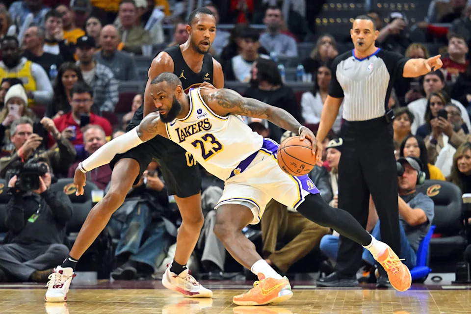 CLEVELAND, OHIO – NOVEMBER 25: LeBron James #23 of the Los Angeles Lakers drives to the basket around <a class="link " href="https://sports.yahoo.com/nba/players/6514/" data-i13n="sec:content-canvas;subsec:anchor_text;elm:context_link" data-ylk="slk:Evan Mobley;sec:content-canvas;subsec:anchor_text;elm:context_link;itc:0" data-yga="{"yLinkElement":"context_link","yModuleName":"content-canvas","yLinkText":"Evan Mobley","ySubModuleName":"anchor_text","yHasCommerce":false}">Evan Mobley</a> #4 of the Cleveland Cavaliers during the fourth quarter at Rocket Mortgage Fieldhouse on November 25, 2023 in Cleveland, Ohio. The Lakers defeated the Cavaliers 121-115. NOTE TO USER: User expressly acknowledges and agrees that, by downloading and or using this photograph, User is consenting to the terms and conditions of the Getty Images License Agreement. (Photo by Jason Miller/Getty Images) | Getty Images