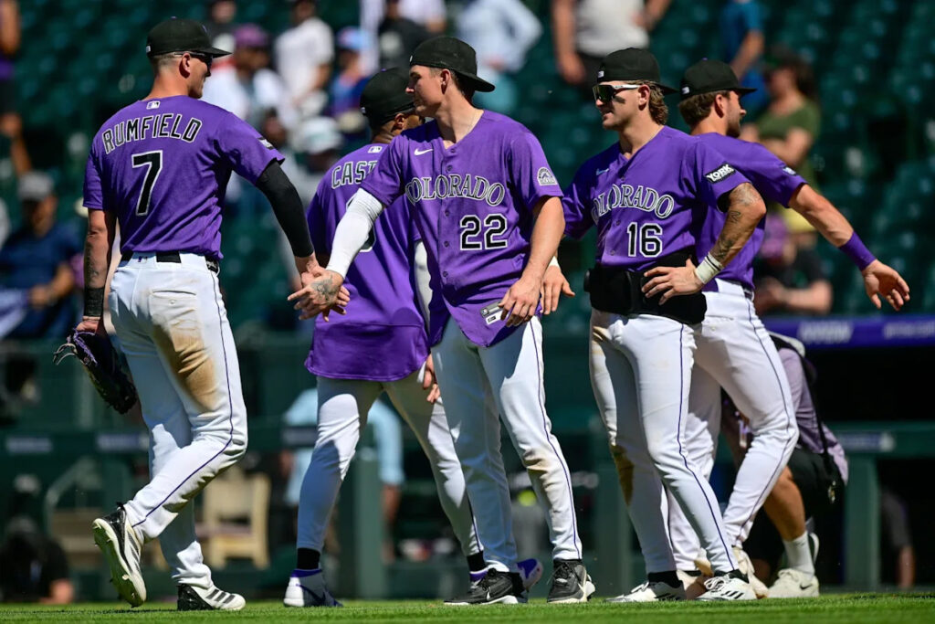 A well-rounded team effort secures a 10-3 win for the Rockies over the Reds A well-rounded team effort secures a 10-3 win for the Rockies over the Reds