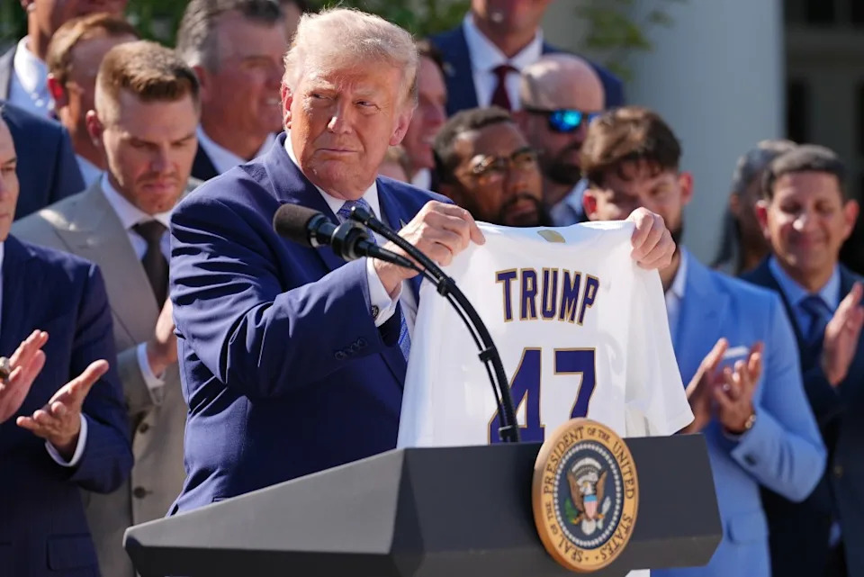 <a class="link " href="https://sports.yahoo.com/mlb/teams/la-dodgers/" data-i13n="sec:content-canvas;subsec:anchor_text;elm:context_link" data-ylk="slk:Dodgers;sec:content-canvas;subsec:anchor_text;elm:context_link;itc:0" data-yga="{"yLinkElement":"context_link","yModuleName":"content-canvas","yLinkText":"Dodgers","ySubModuleName":"anchor_text","yHasCommerce":false}">Dodgers</a> owner Mark Walter presented President Donald Trump with a jersey and championship ring. AP Photo/Julia Demaree Nikhinson