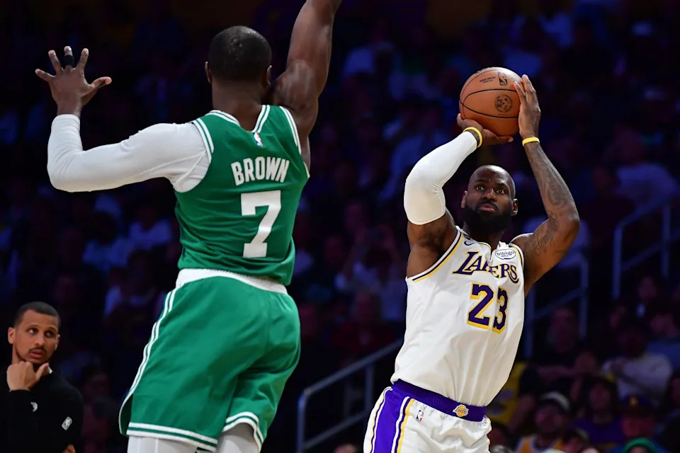 Los Angeles Lakers forward LeBron James (23) shoots against Boston Celtics guard Jaylen Brown (7) during the second half at Crypto.com Arena in Los Angeles, California, on Feb. 22, 2026.