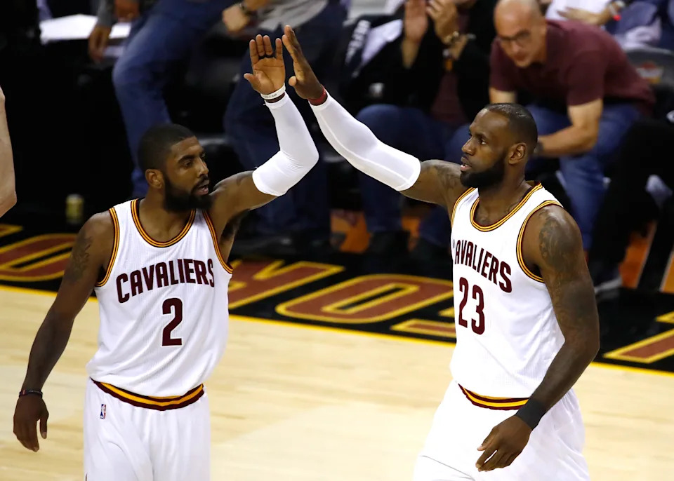 CLEVELAND, OH - JUNE 09: Kyrie Irving #2 and LeBron James #23 of the Cleveland Cavaliers celebrate after a play in the first quarter against the Golden State Warriors in Game 4 of the 2017 NBA Finals at Quicken Loans Arena on June 9, 2017 in Cleveland, Ohio. NOTE TO USER: User expressly acknowledges and agrees that, by downloading and or using this photograph, User is consenting to the terms and conditions of the Getty Images License Agreement.  (Photo by Gregory Shamus/Getty Images)