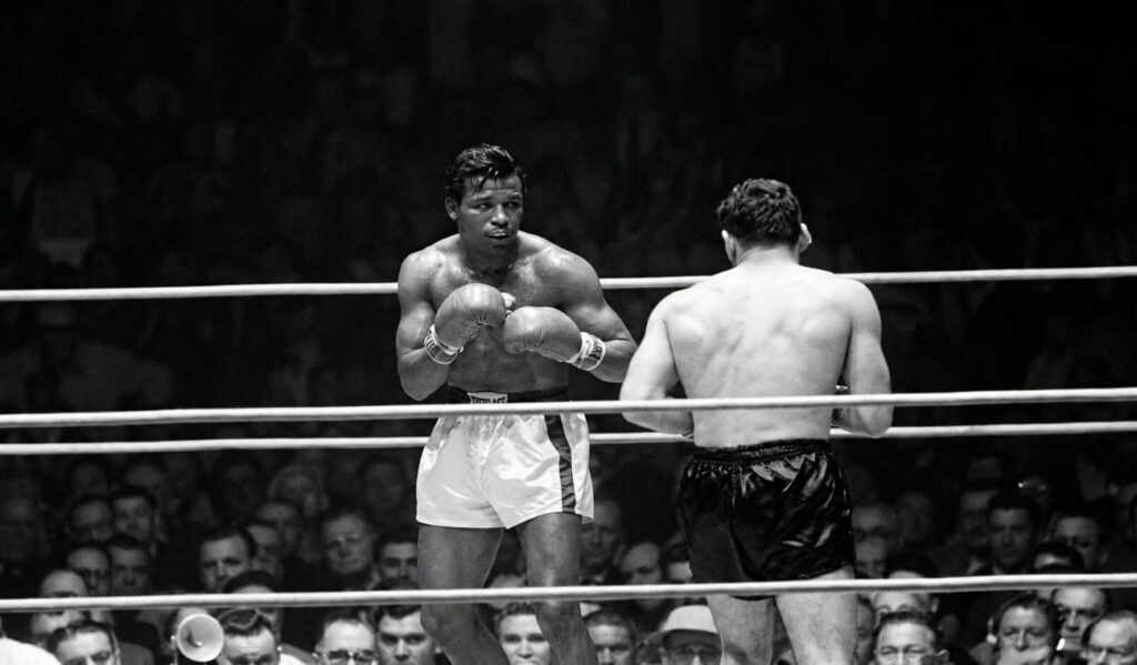Sugar Ray Robinson Survives Knockdown To Defeat Rocky Castellani