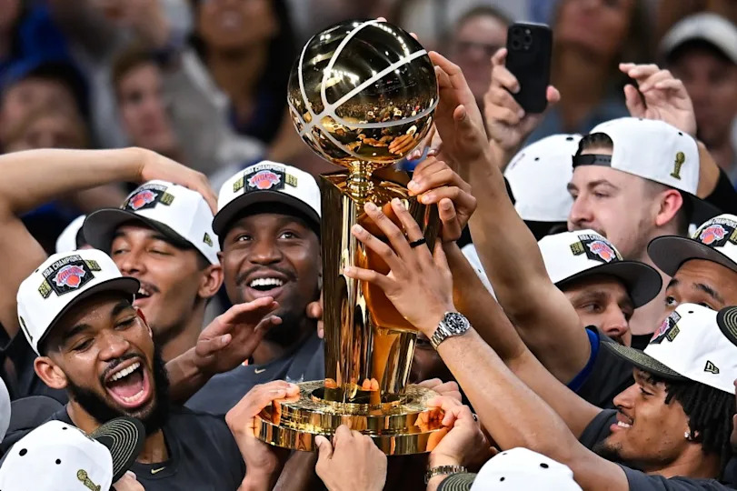 The New York Knicks celebrate with the Larry O’Brien Championship Trophy after defeating the <a class="link " href="https://sports.yahoo.com/nba/teams/san-antonio/" data-i13n="sec:content-canvas;subsec:anchor_text;elm:context_link" data-ylk="slk:San Antonio Spurs;sec:content-canvas;subsec:anchor_text;elm:context_link;itc:0" data-yga="{"yLinkElement":"context_link","yModuleName":"content-canvas","yLinkText":"San Antonio Spurs","ySubModuleName":"anchor_text","yHasCommerce":false}">San Antonio Spurs</a>. AP Photo/Darren Abate