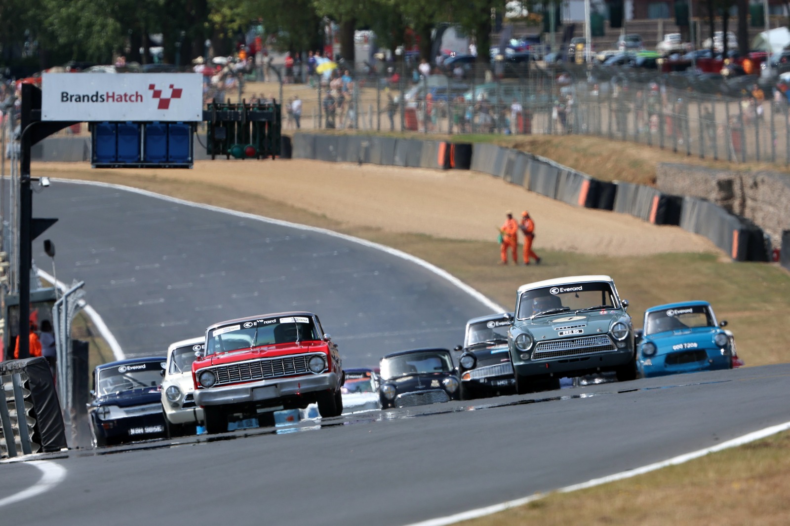 Grange's Ford Falcon (l) bagged two wins over the Touring Car Rewind weekend