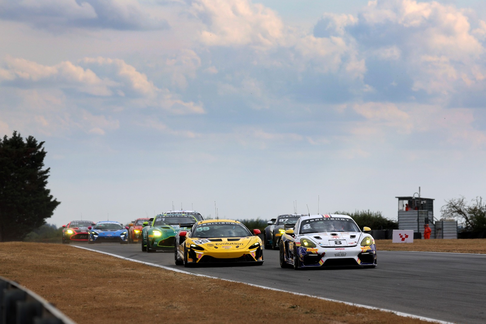 Gamble (l) and Bradshaw had a close battle at the start of race two, but the McLaren ultimately prevailed