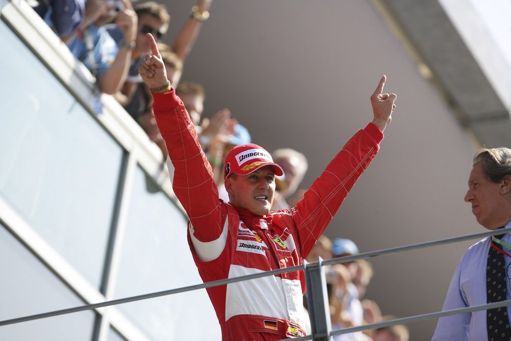 An emotional Schumacher makes his way to the Monza podium